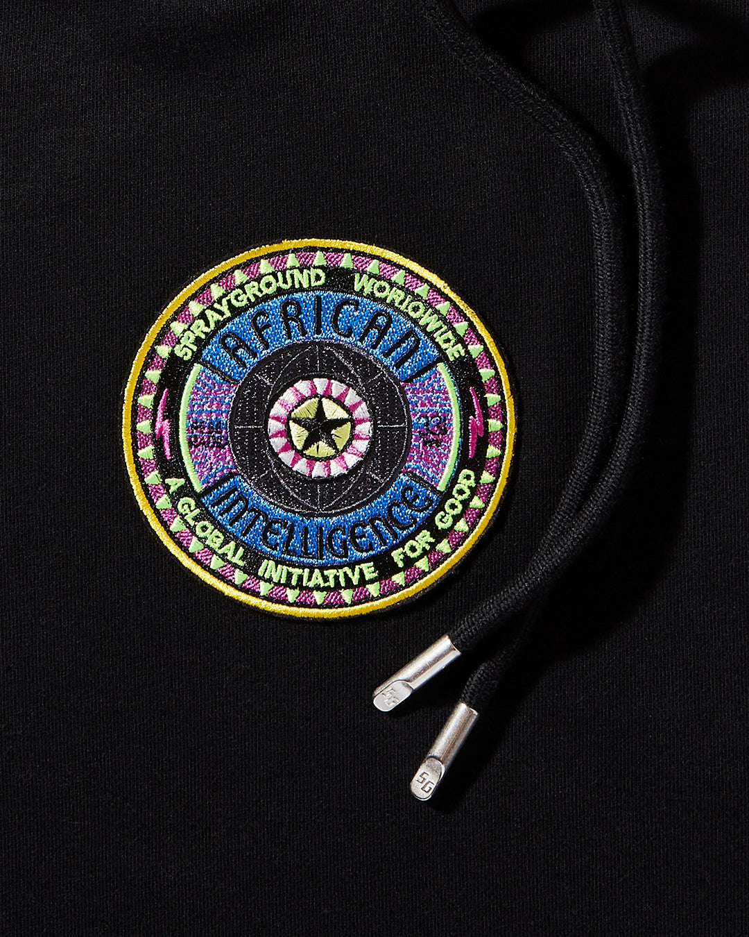 Close-up of the shark mouth tape detailing on the hoodie