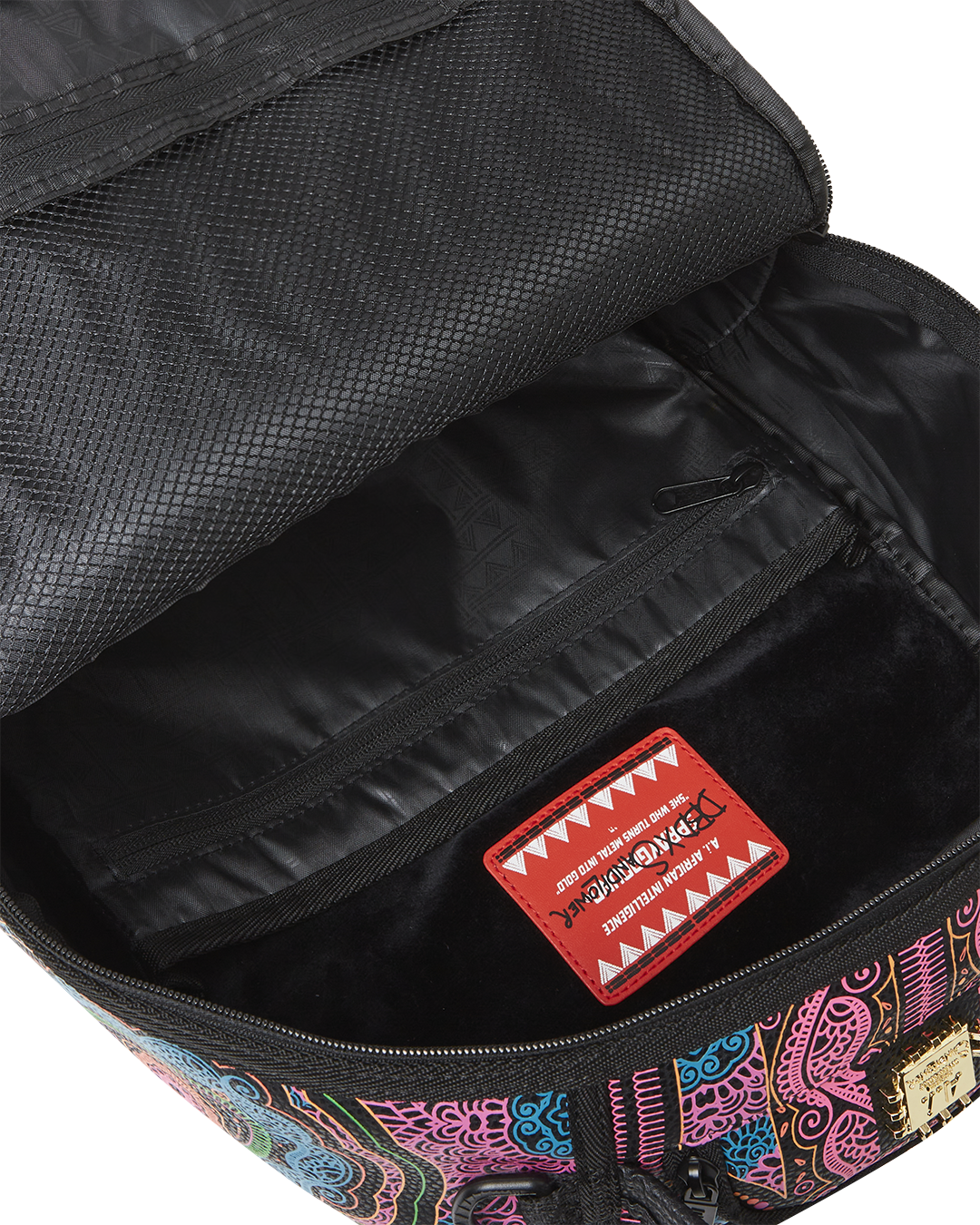Close-up of gold metal zippers and velour laptop compartment ideal for creative professionals.