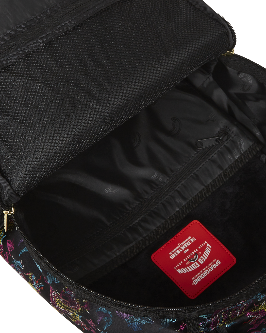 Side view highlighting water-resistant faux leather material and side pockets