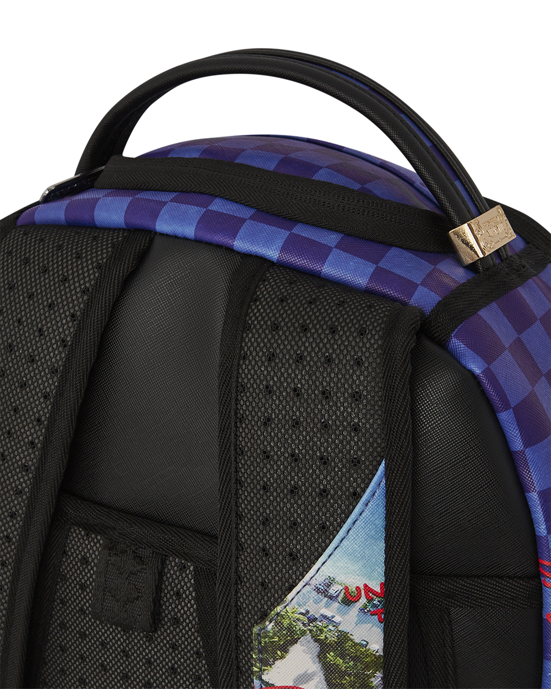 Sprayground Shark Island backpack open, showcasing laptop compartment and interior pockets