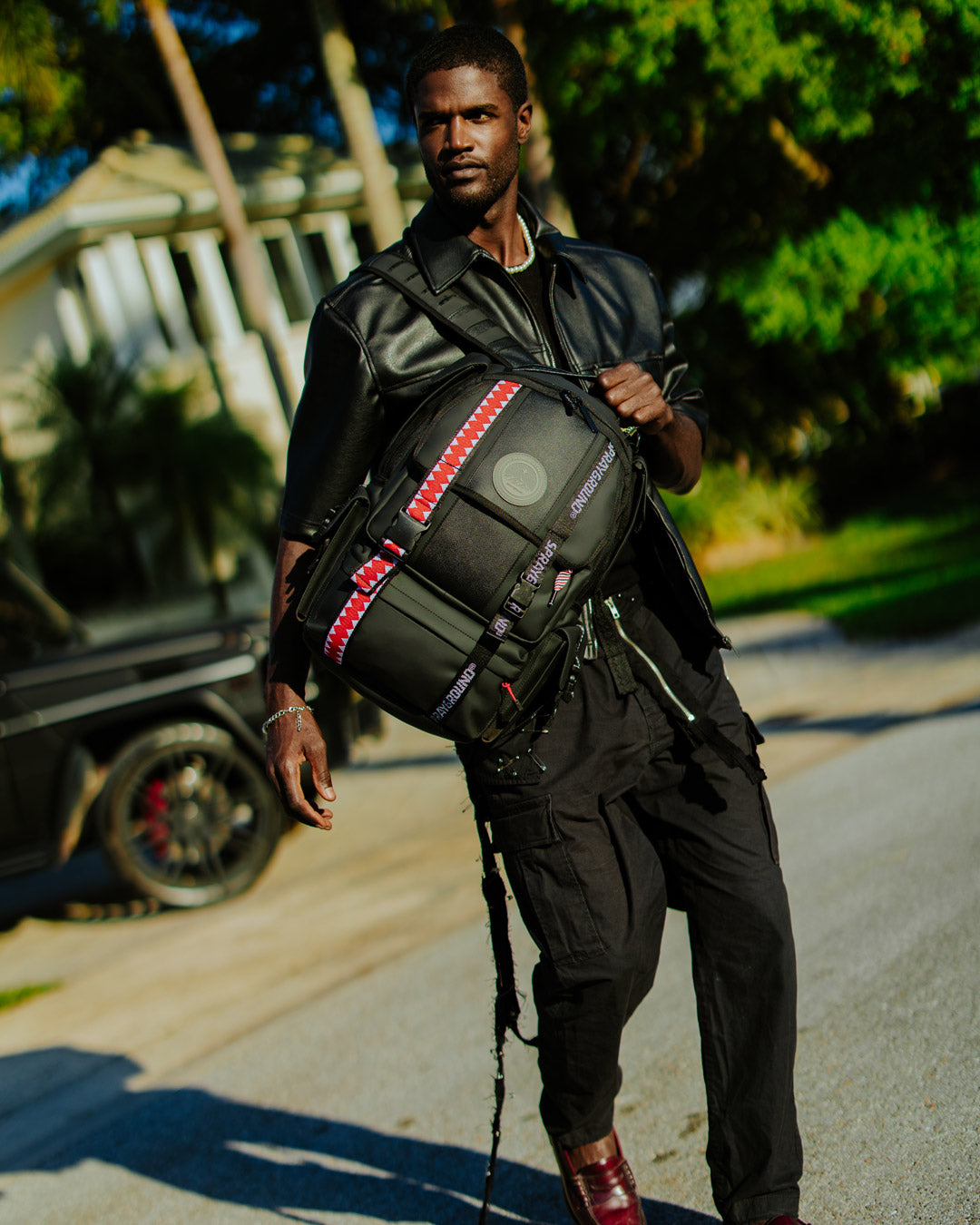 Timbuk2 Authority Deluxe Faux Leather Backpack - side view showing adjustable straps
