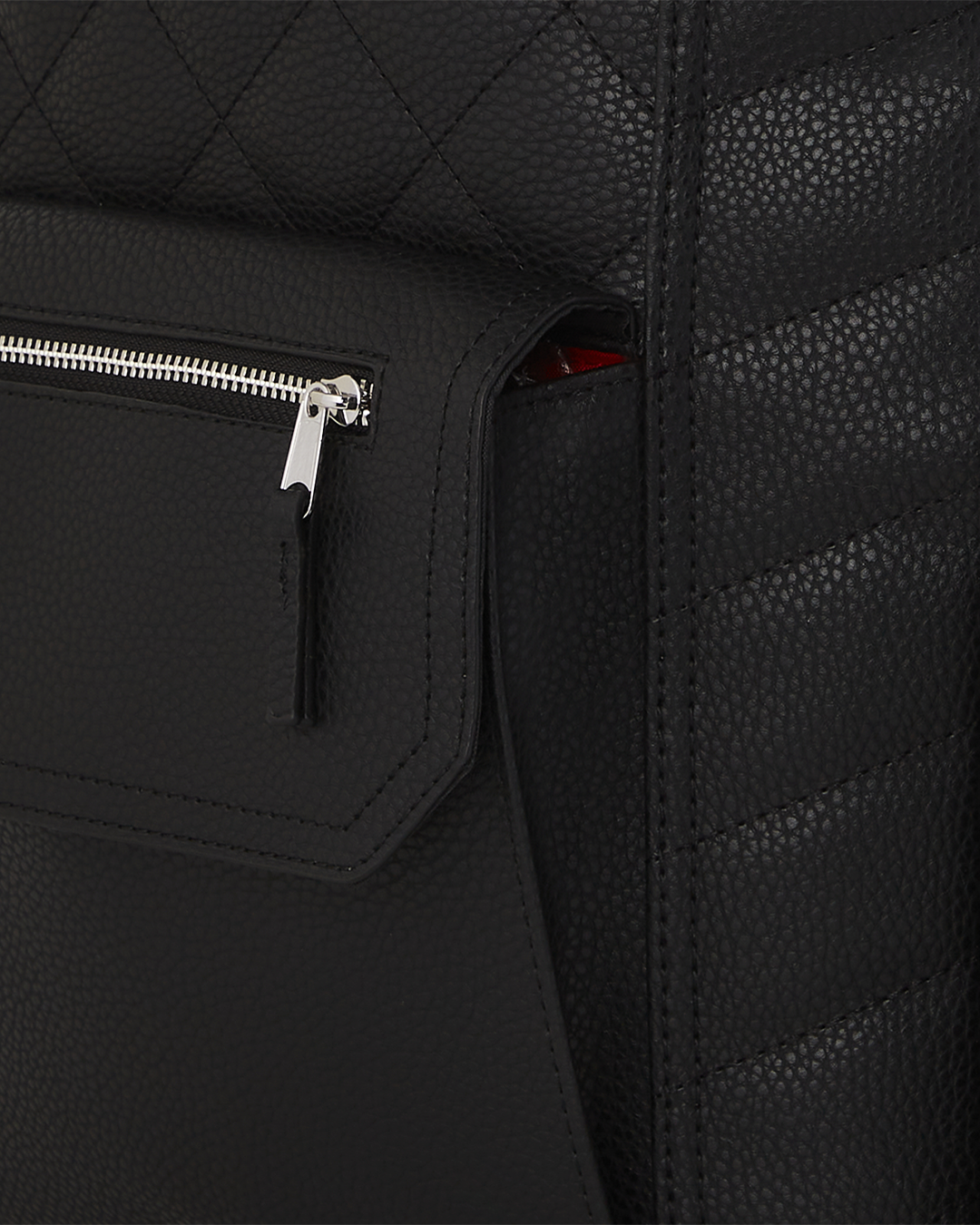 Model wearing the black leather backpack mens style with a tailored coat