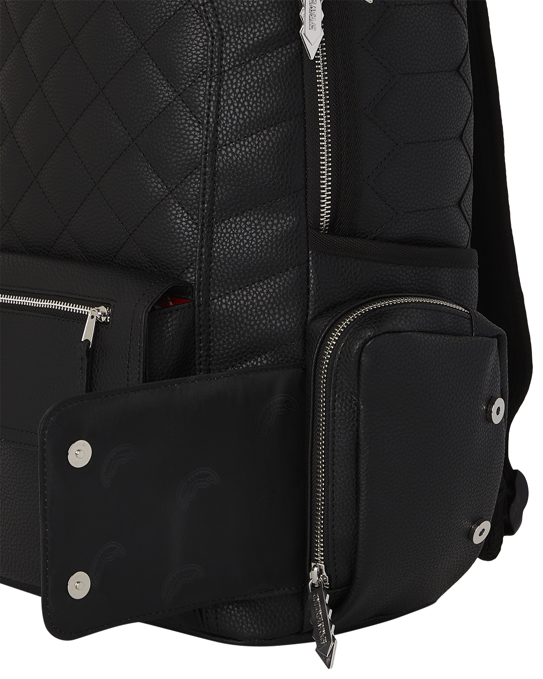 Side view of backpack open to reveal laptop compartment and organizational pockets