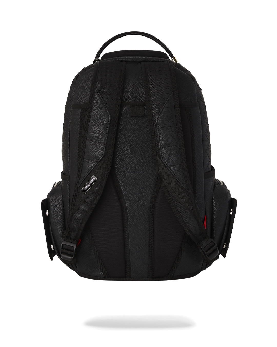 Close-up of Strada mens leather backpack showcasing quilted texture and stud details