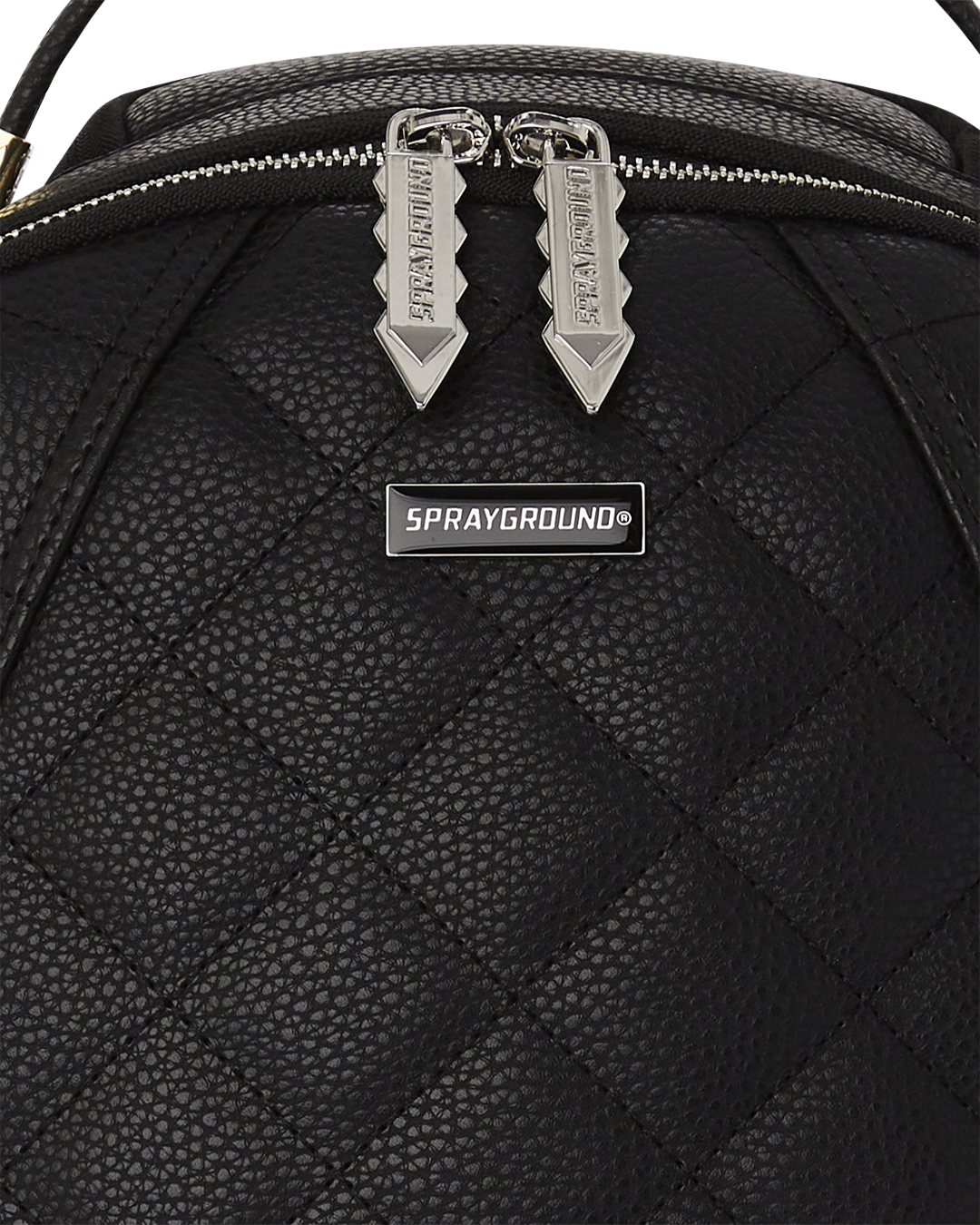 Close-up of Strada mens leather backpack showcasing quilted texture and stud details