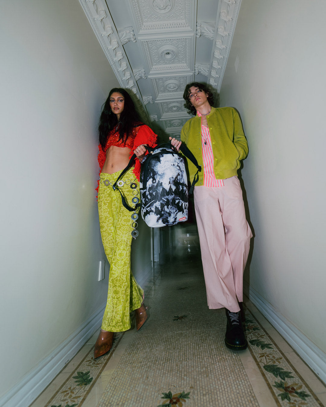 Back sleeve feature connecting to carry-on luggage, perfect for designers on the go