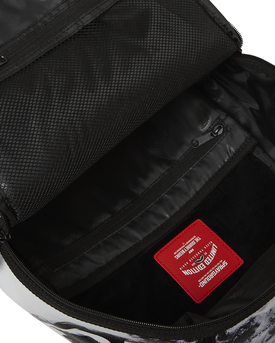 Back sleeve feature connecting to carry-on luggage, perfect for designers on the go