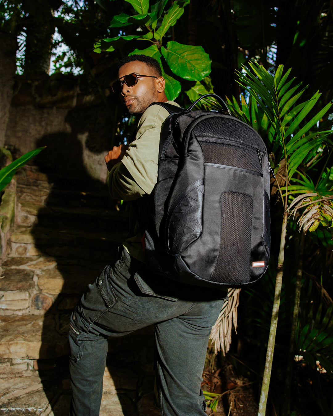 Side view of the Nomad Basecamp backpack, perfect for travel.