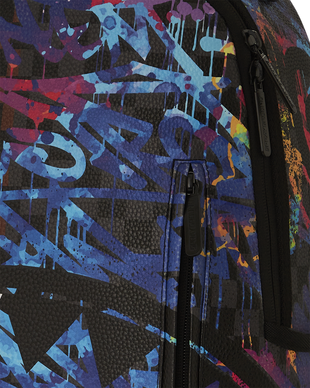 Detail shot of the faux leather material with glow-in-the-dark accents on the backpack