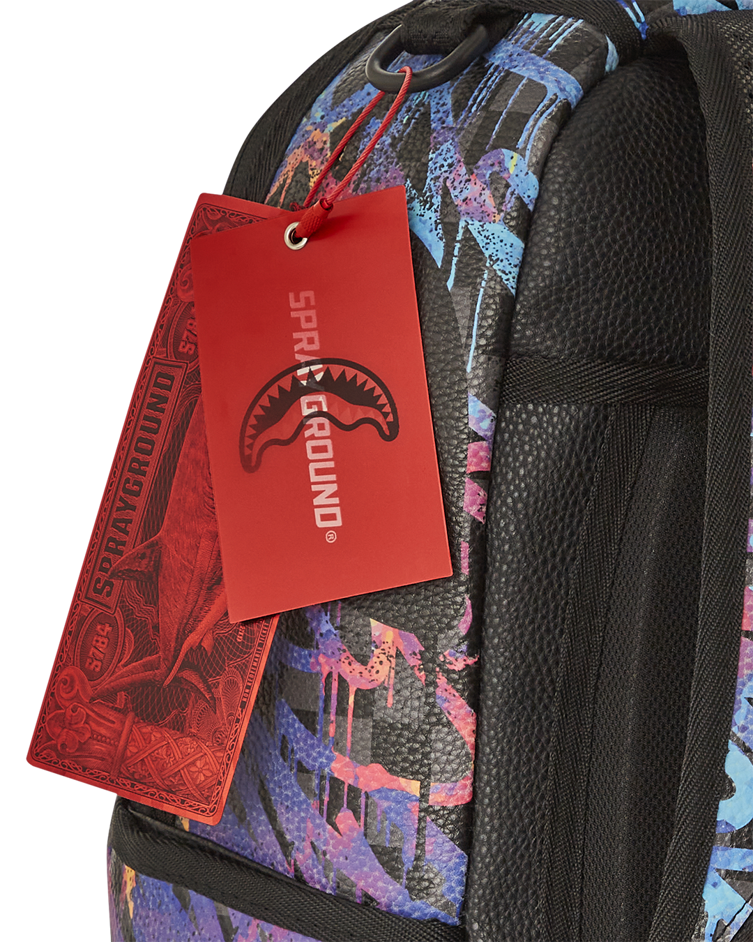 Detail shot of the faux leather material with glow-in-the-dark accents on the backpack