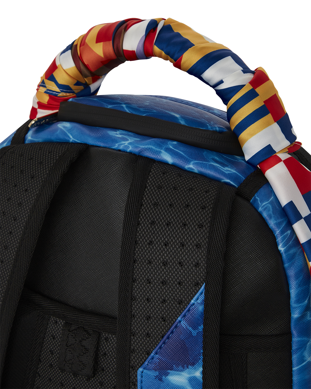 Nautica backpack worn over shoulder, showcasing removable scarf detail