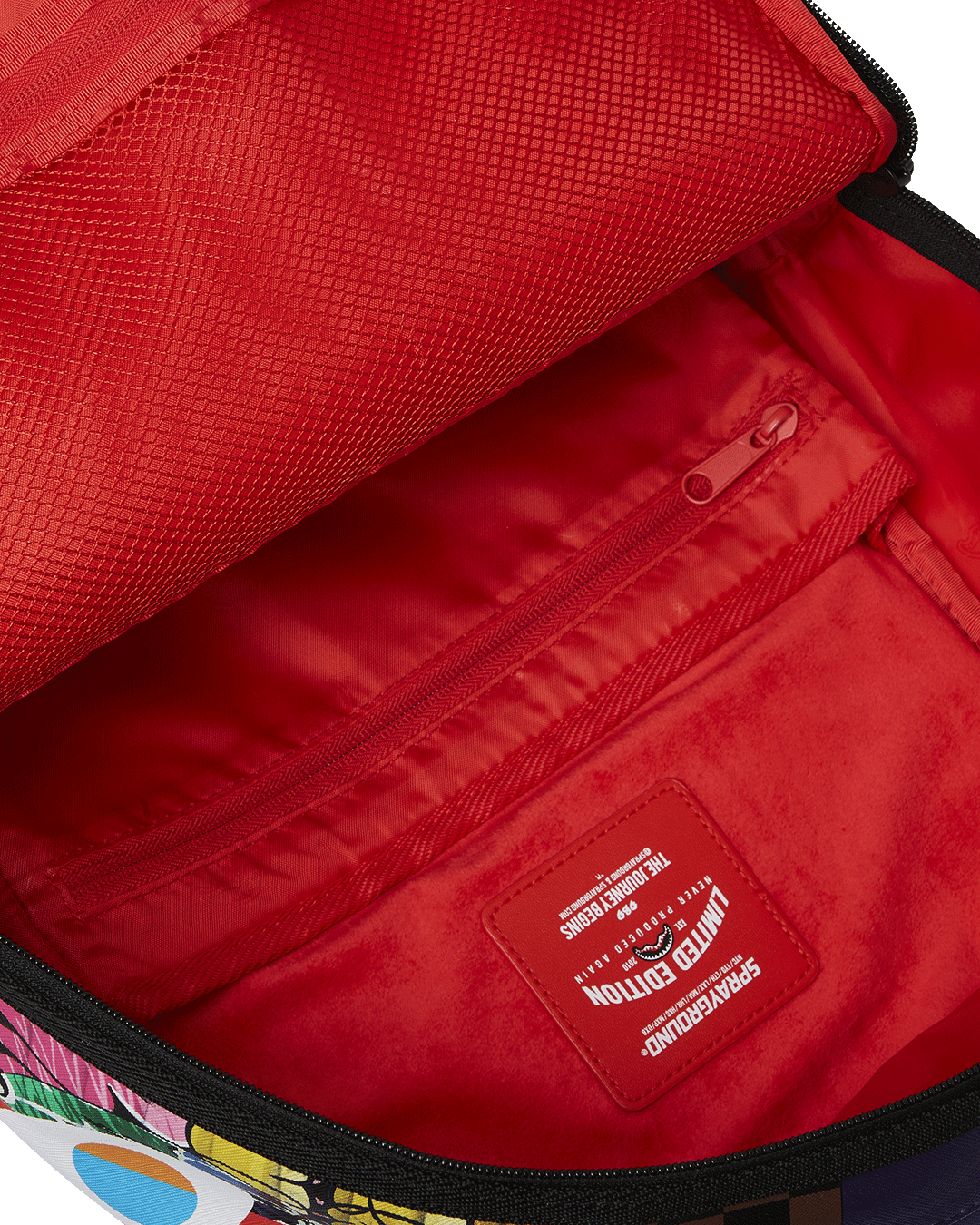 Back of the faux leather backpack with slide-through sleeve for luggage.