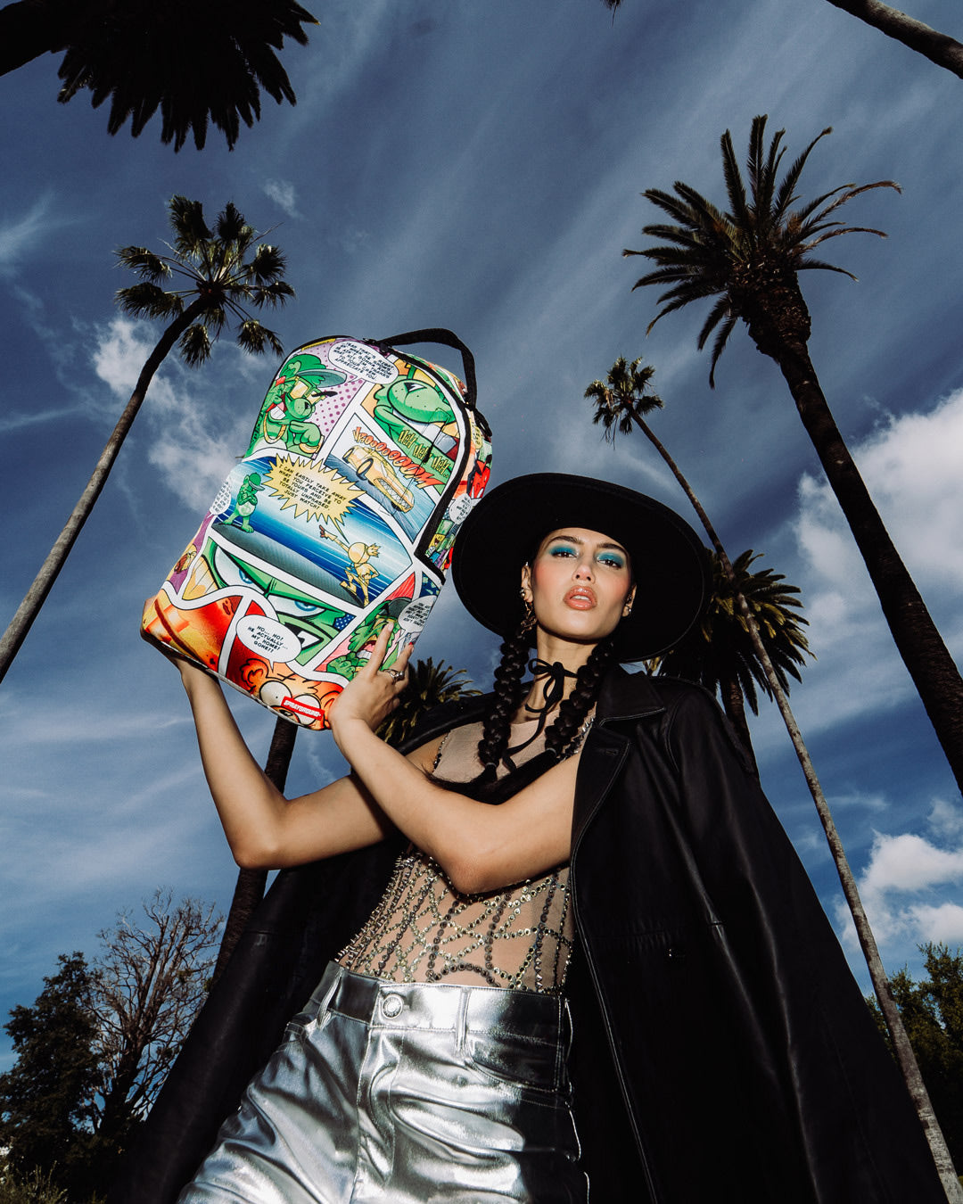 Sprayground Ignition DLXSR Backpack in use, showcasing ergonomic mesh back