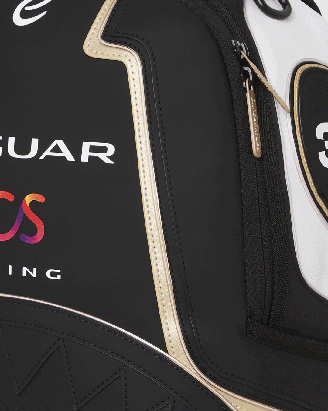 Jaguar Formula-E LED backpack glowing at night, worn over a leather jacket