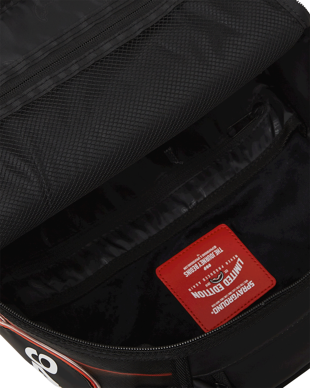 Close-up of LED backpack strap with USB charging port and luxe stitching
