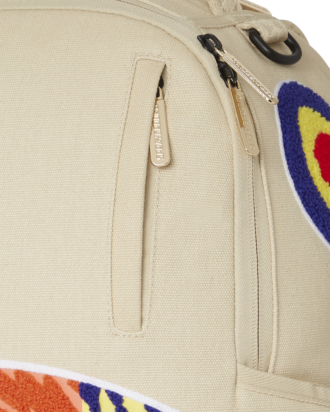 Side view of the backpack with side pockets and slide-through luggage sleeve.