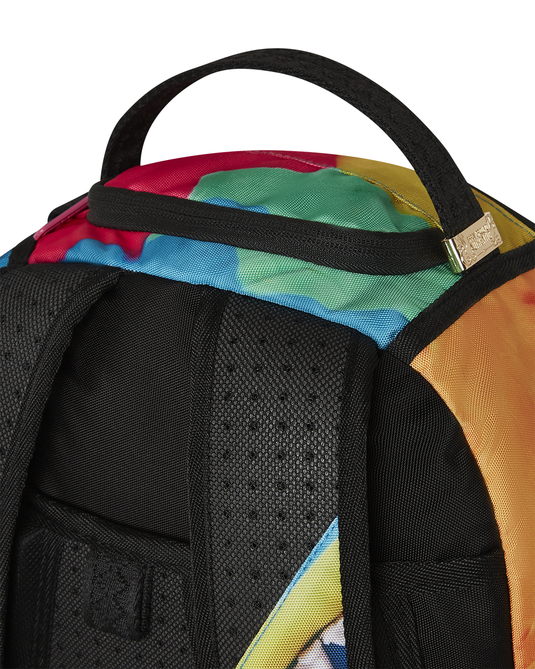 Close-up of pink Sprayground backpack’s front pocket and metal hardware