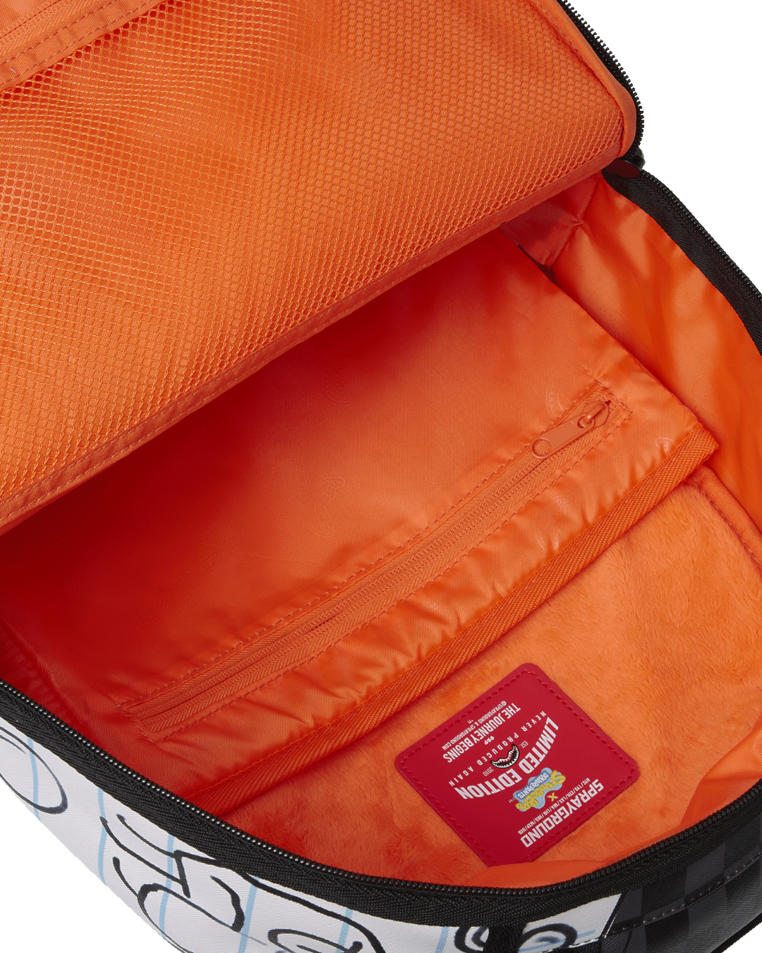 Side profile of the faux leather backpack with slide-through luggage sleeve for airport use