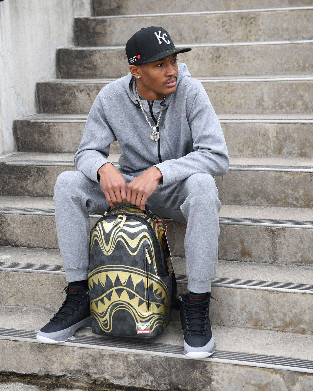 Peak Design travel backpack styled with a laptop and sunglasses