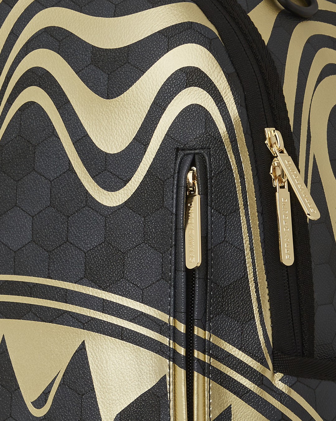 Close-up of the backpack’s ergonomic padding and gold zippers