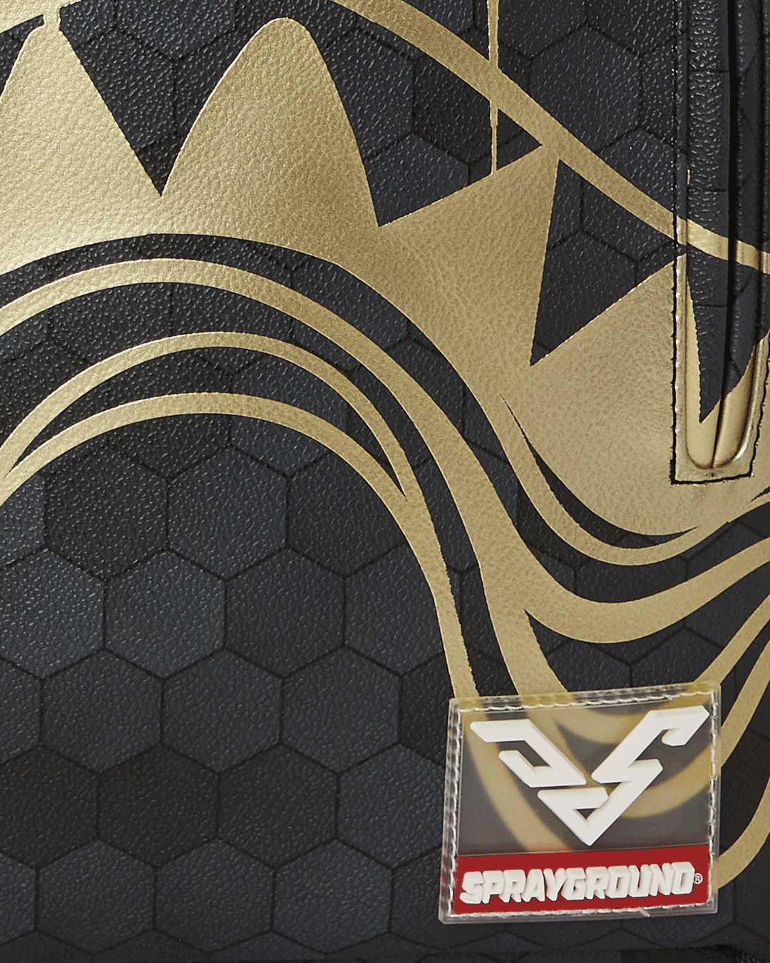 Close-up of the backpack’s ergonomic padding and gold zippers