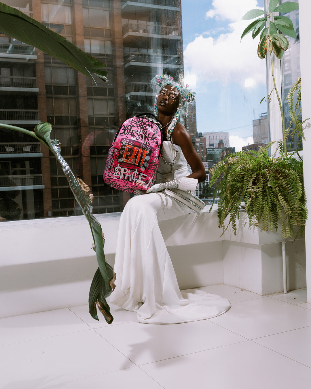 Side view of the backpack showing side pockets and adjustable straps