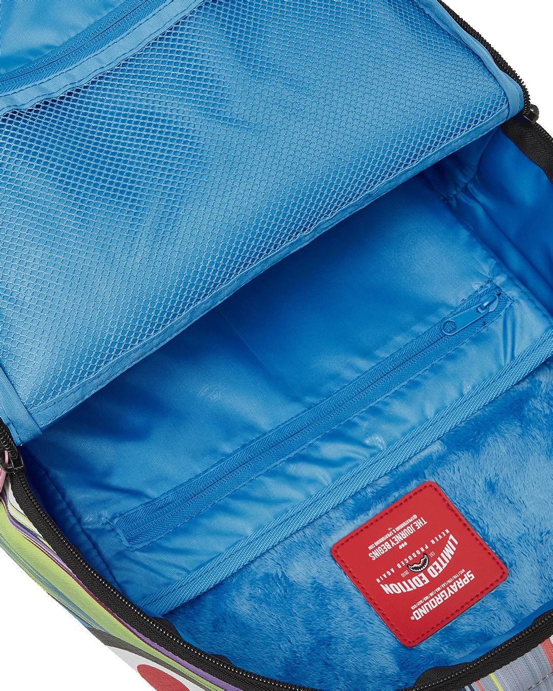 Back sleeve attachment demonstrating how the backpack fits over a carry-on handle