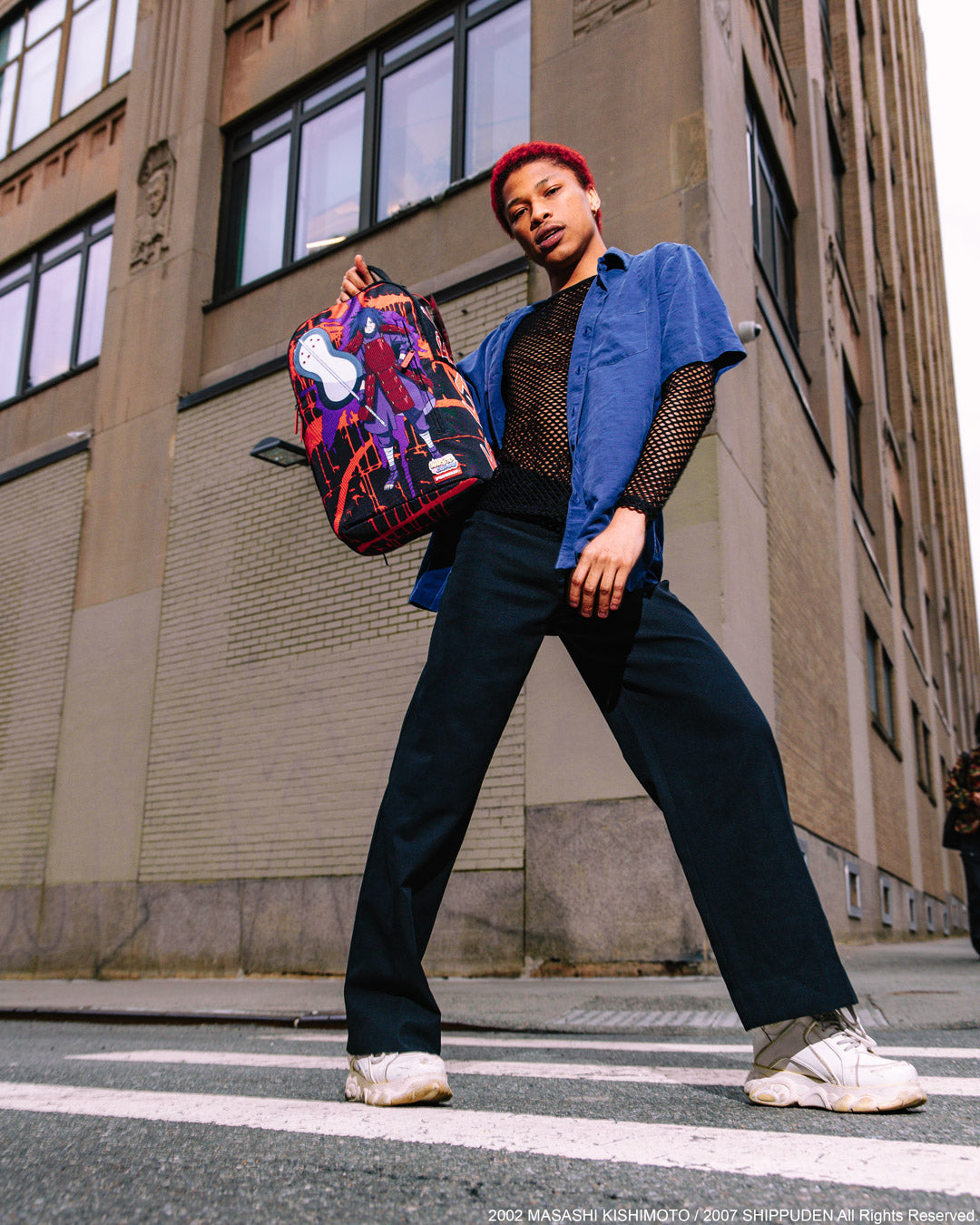 Madara StandTall DLXSR backpack with front zipper pocket and side pockets for travel