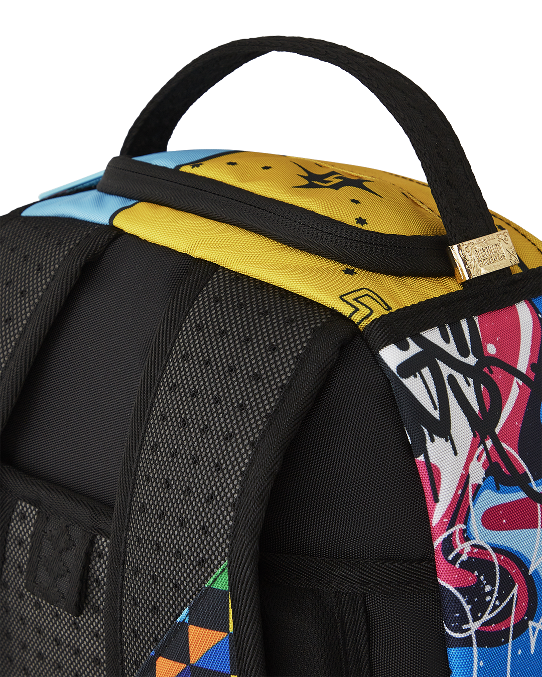Sprayground DLXSR Collage Backpack in Pink being worn by a student on a college campus