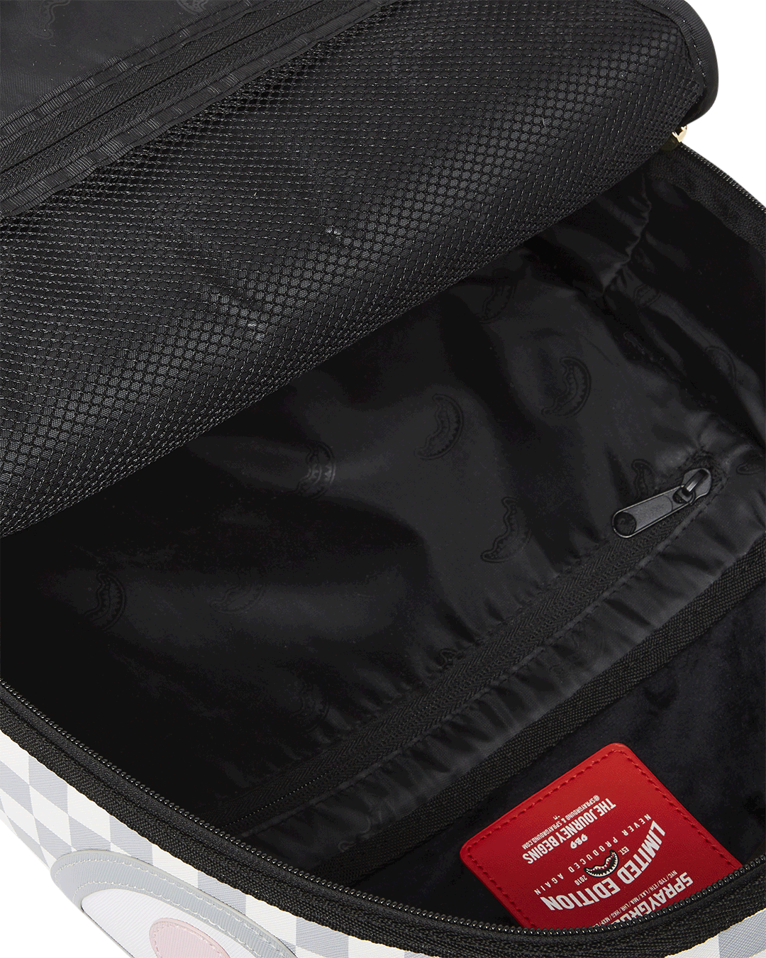 Shark Bite Luxe Backpack showcasing front zipper pocket and side pockets.