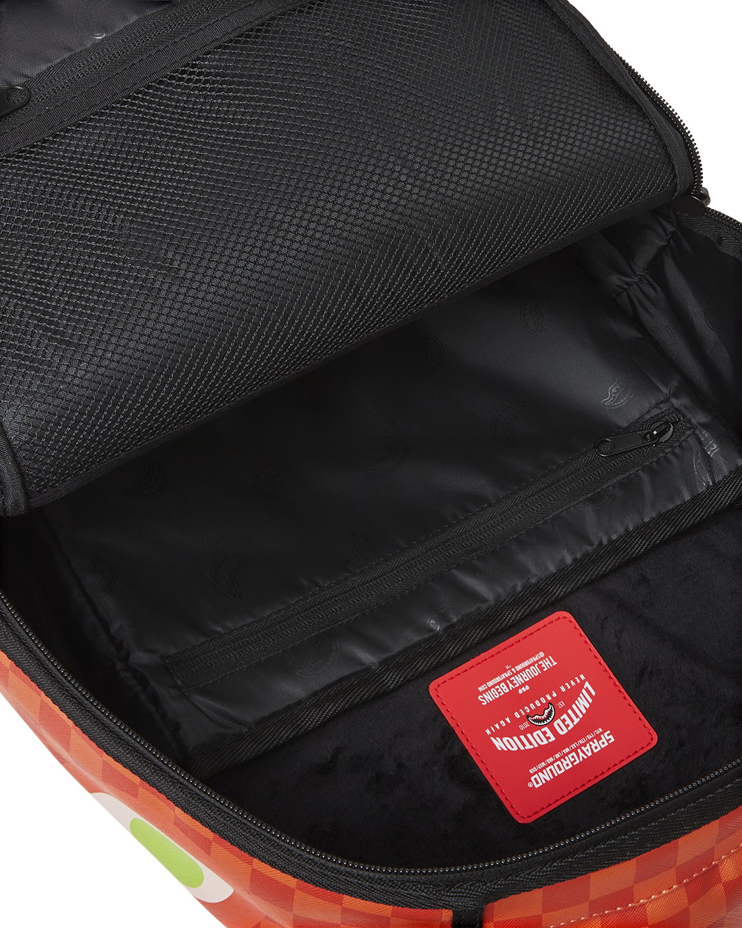 Inside look at the leather laptop backpack showing velour laptop compartment and organizer pocket