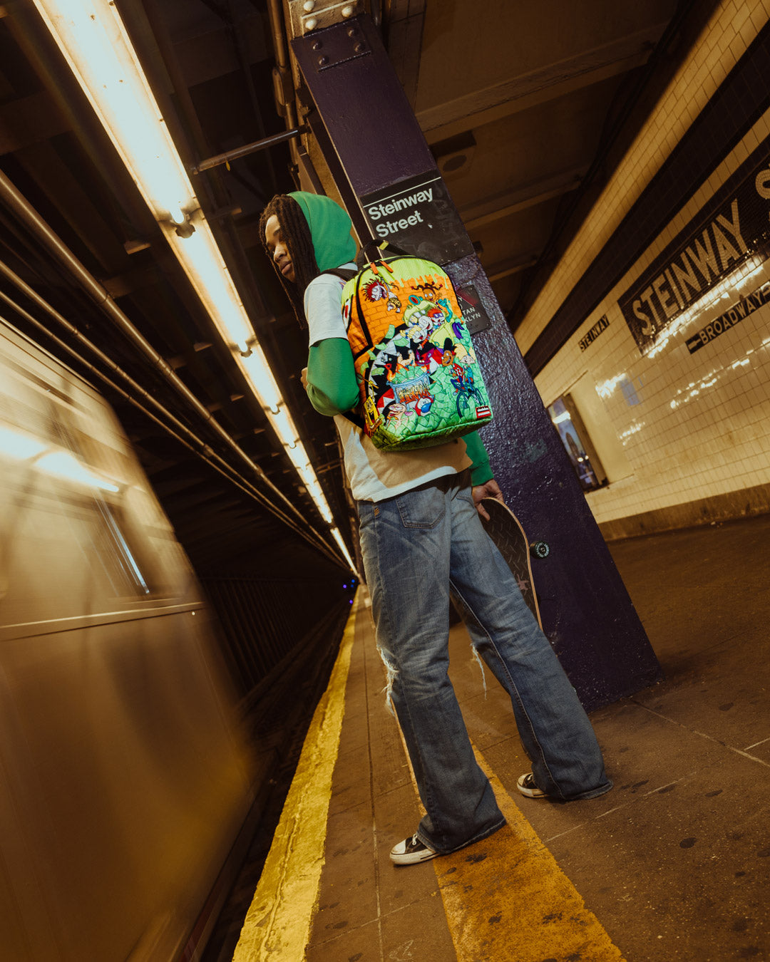 Side view of the Retro Vibes DLXSR Backpack with adjustable straps and pockets for organization.