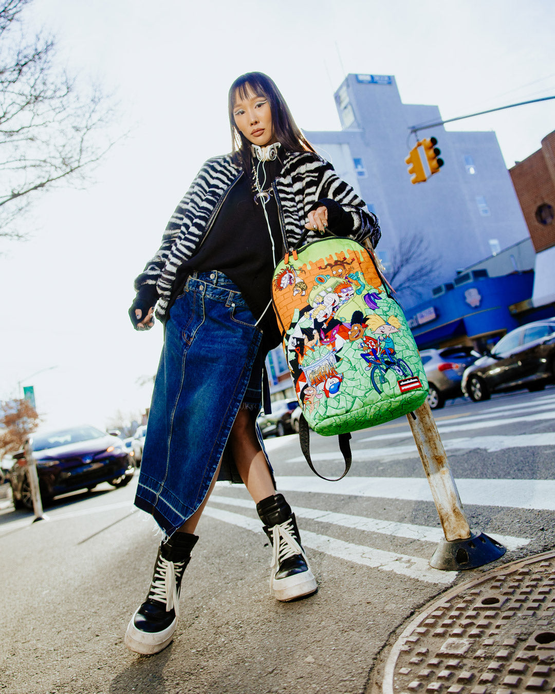 Side view of the Retro Vibes DLXSR Backpack with adjustable straps and pockets for organization.