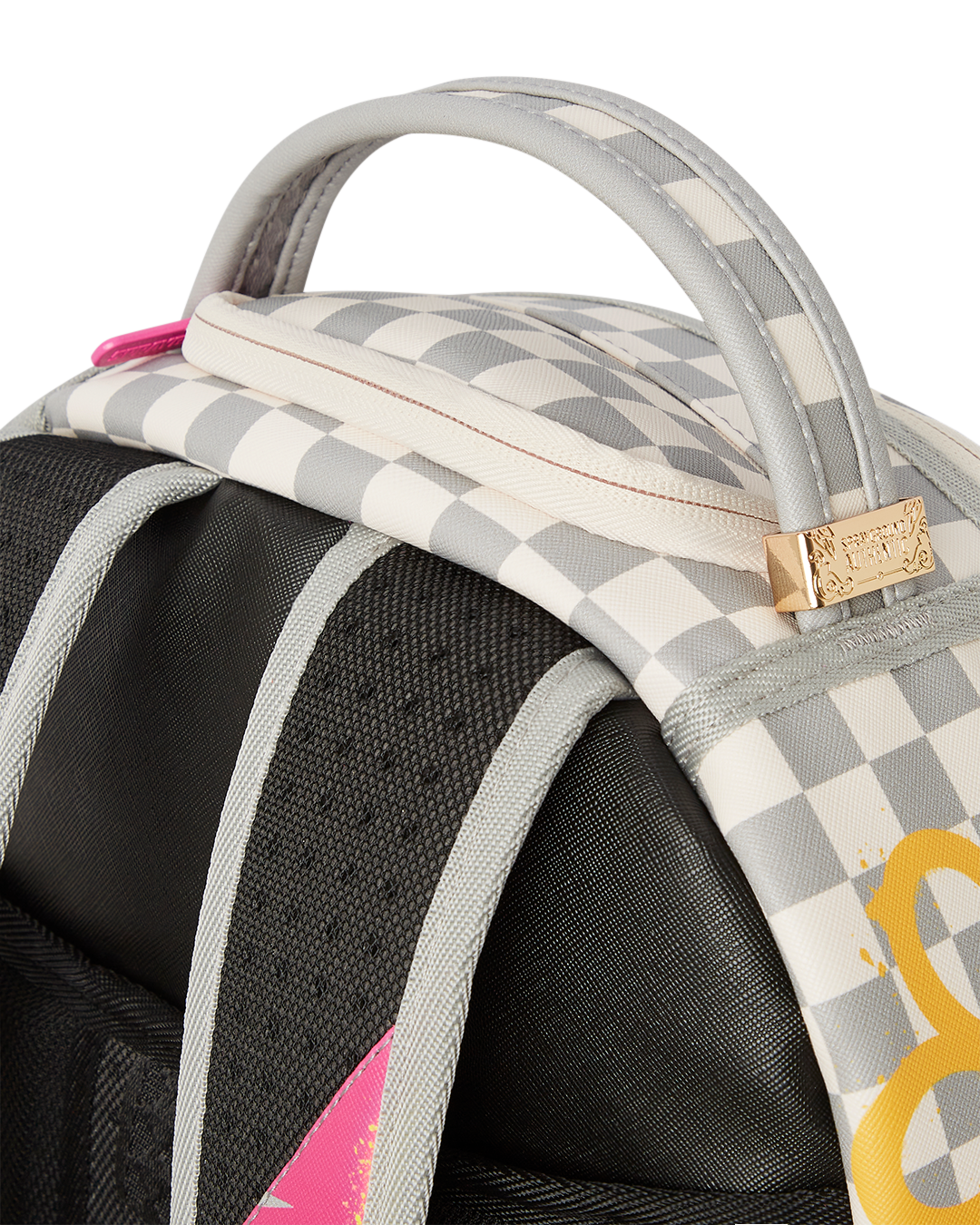 Side view of Susie Vibes faux leather backpack with gold zippers.