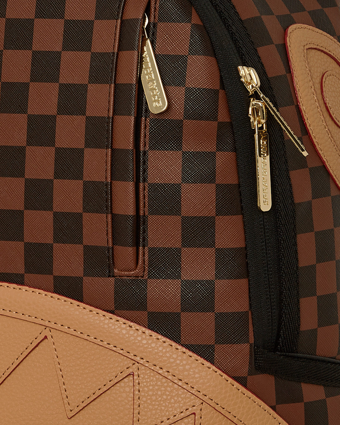 Close-up of faux leather texture and gold hardware details