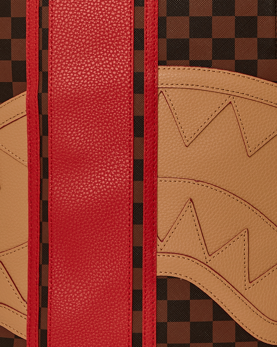 Close-up of faux leather texture and gold hardware details