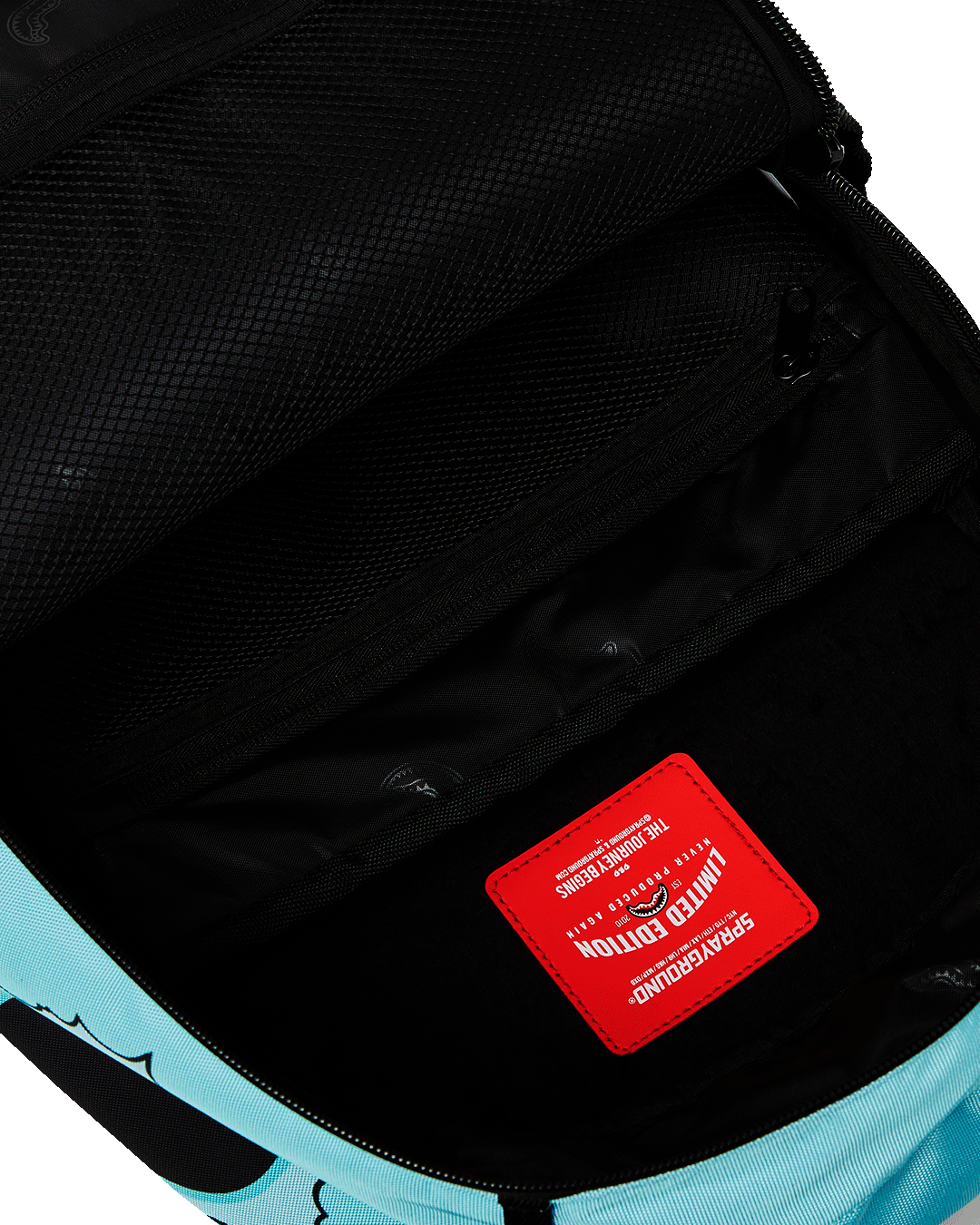 Sprayground backpack side view showing adjustable straps and ergonomic mesh back padding