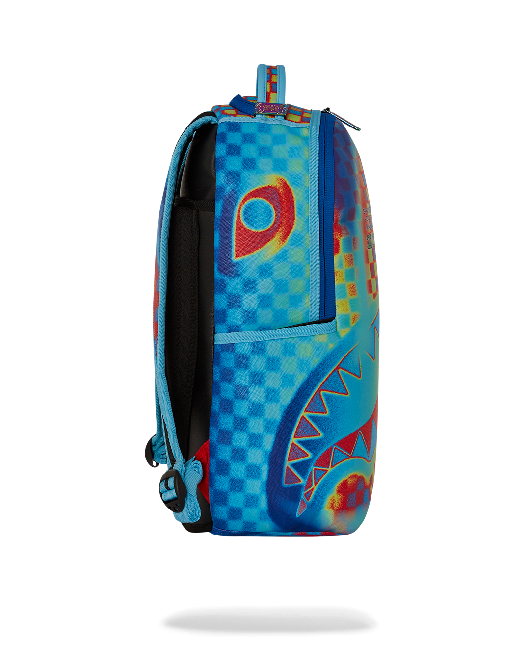 Side angle showing Sprayground backpack pink accents and luggage strap