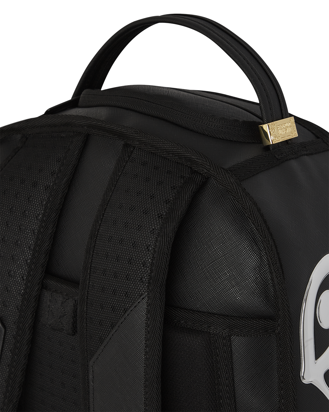 Front view of silver backpack with sharkmouth detail on sidewalk in Manhattan