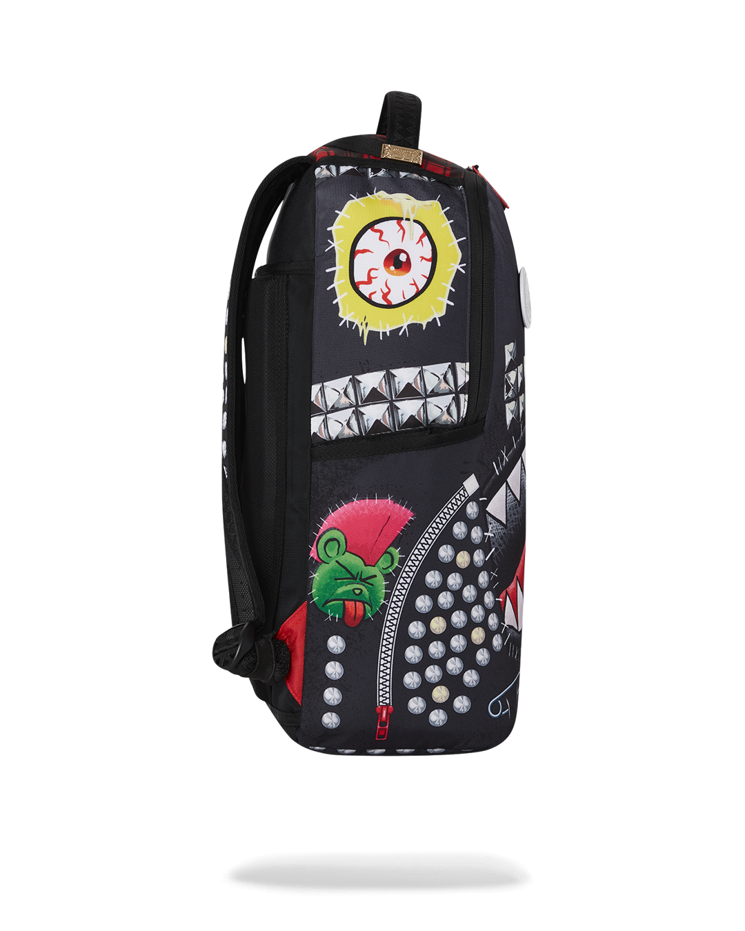 Close-up of the backpacks metal Sprayground Authentic badge and gold zippers