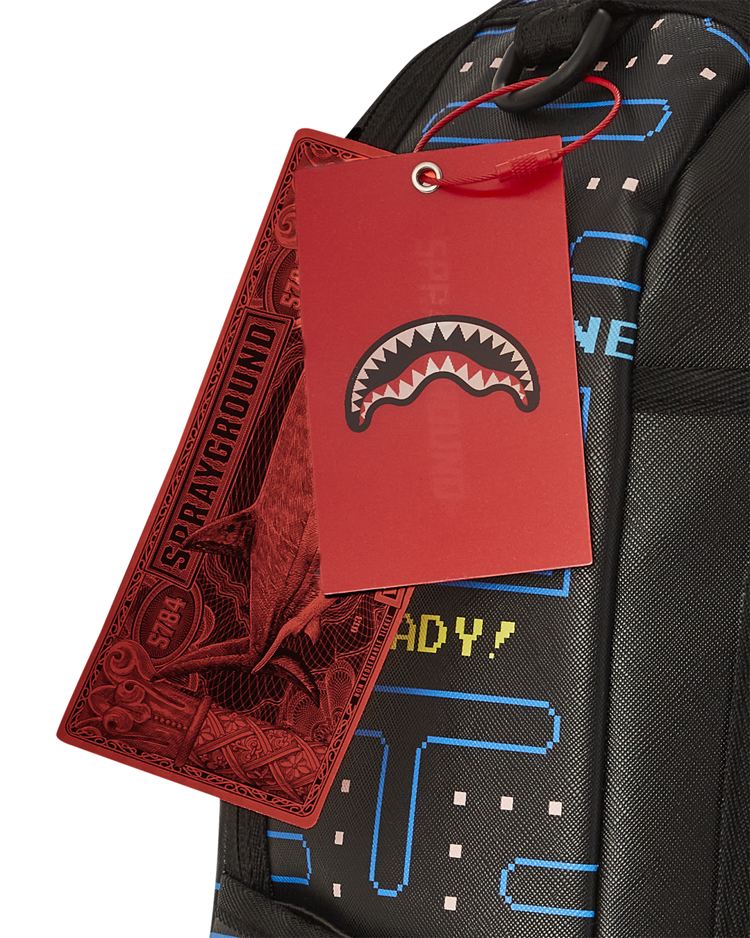 Close-up of PAC-MAN Livin the Dream faux leather backpack showing gold zippers and metal hardware
