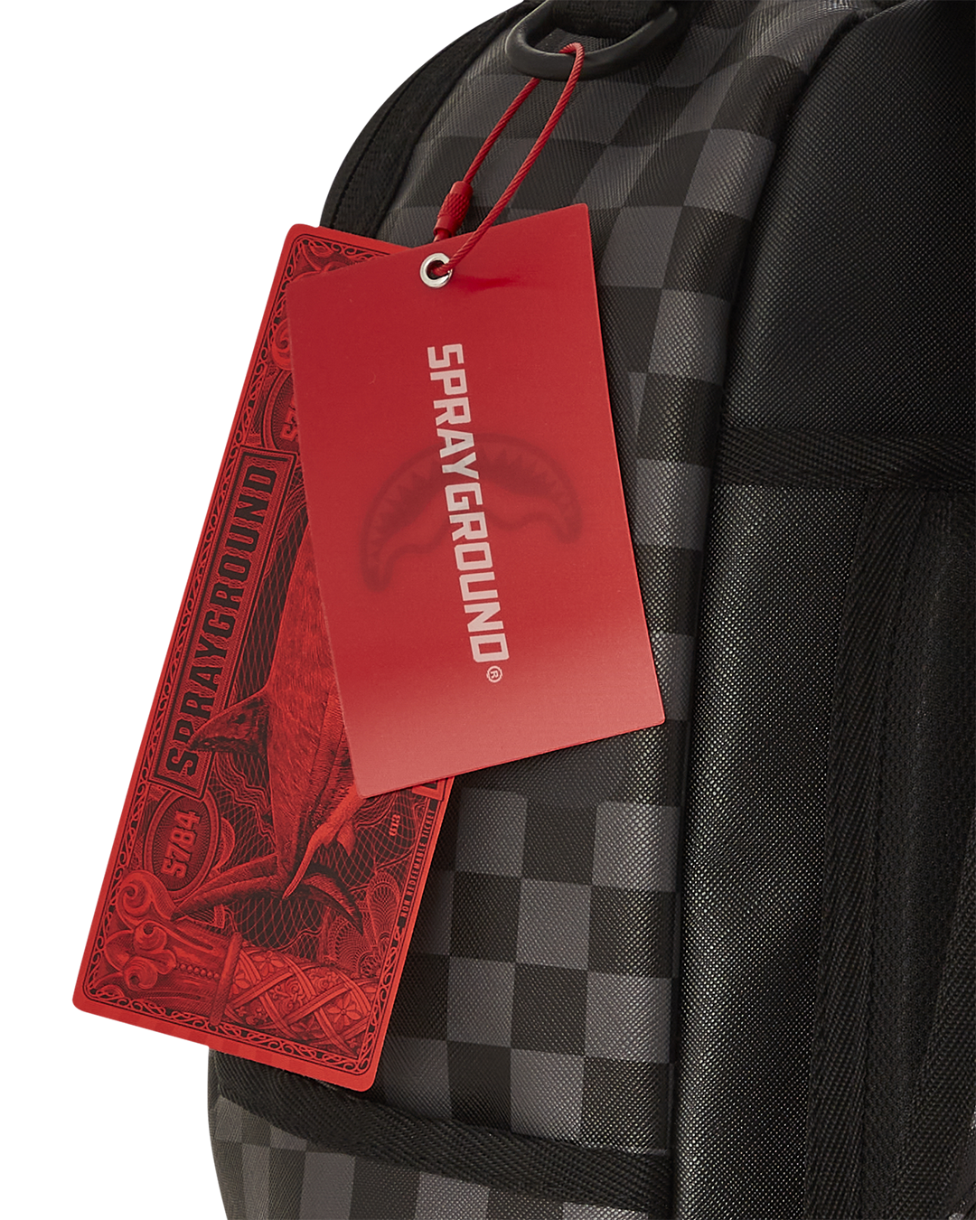 Astromane backpack displayed on a travel suitcase, showcasing the slide-through back sleeve