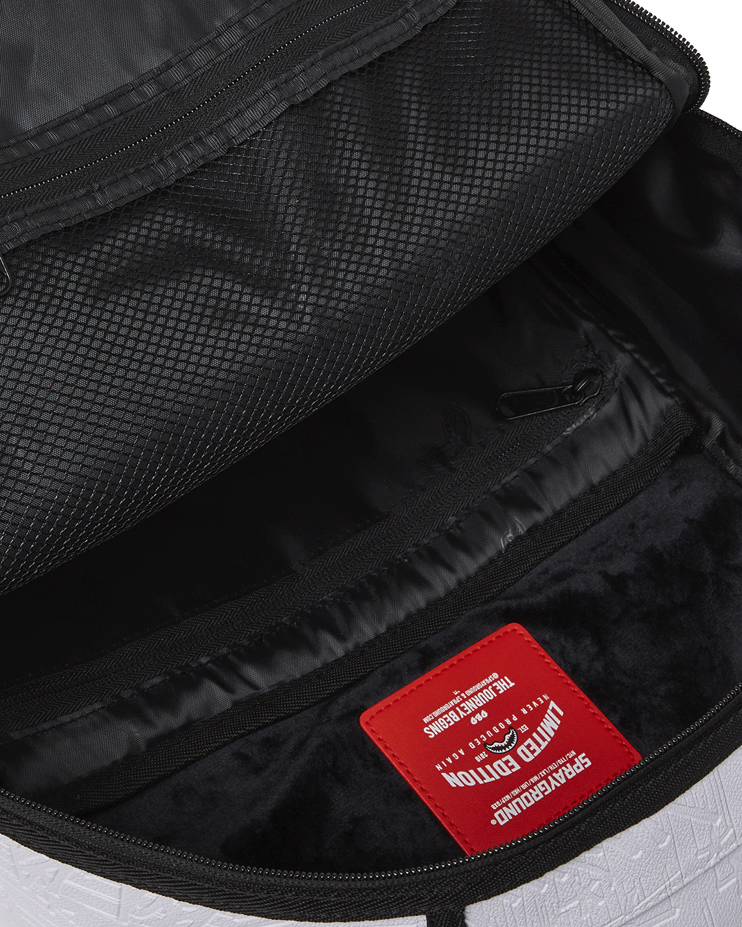 Side view of the backpack with side pockets and ergonomic mesh back padding