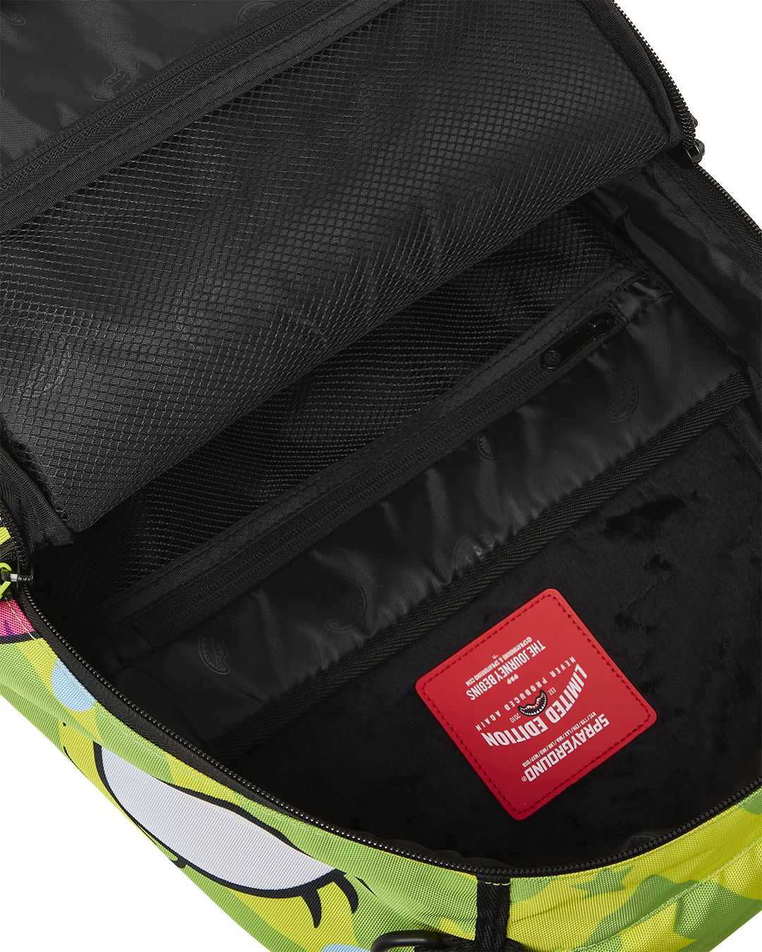 Interior of the faux leather backpack showing the laptop compartment and organizer.