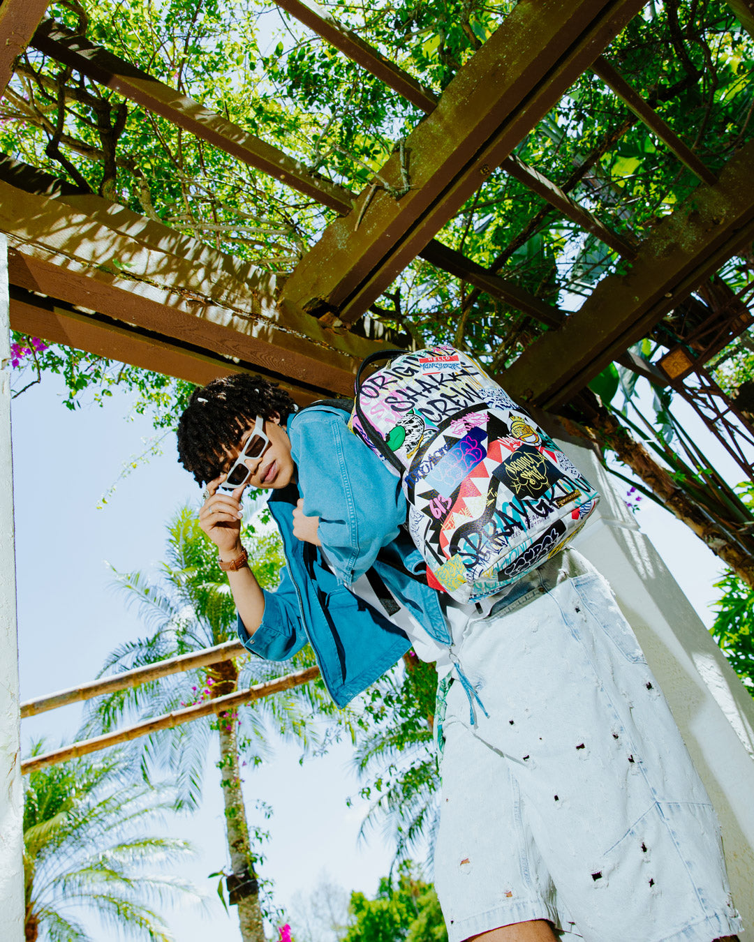 Interior view of the backpack showing laptop compartment and mesh organizer pocket