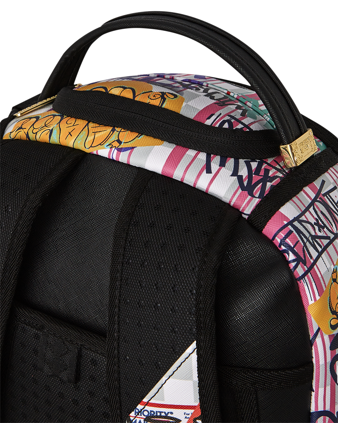 Interior view of the backpack showing laptop compartment and mesh organizer pocket