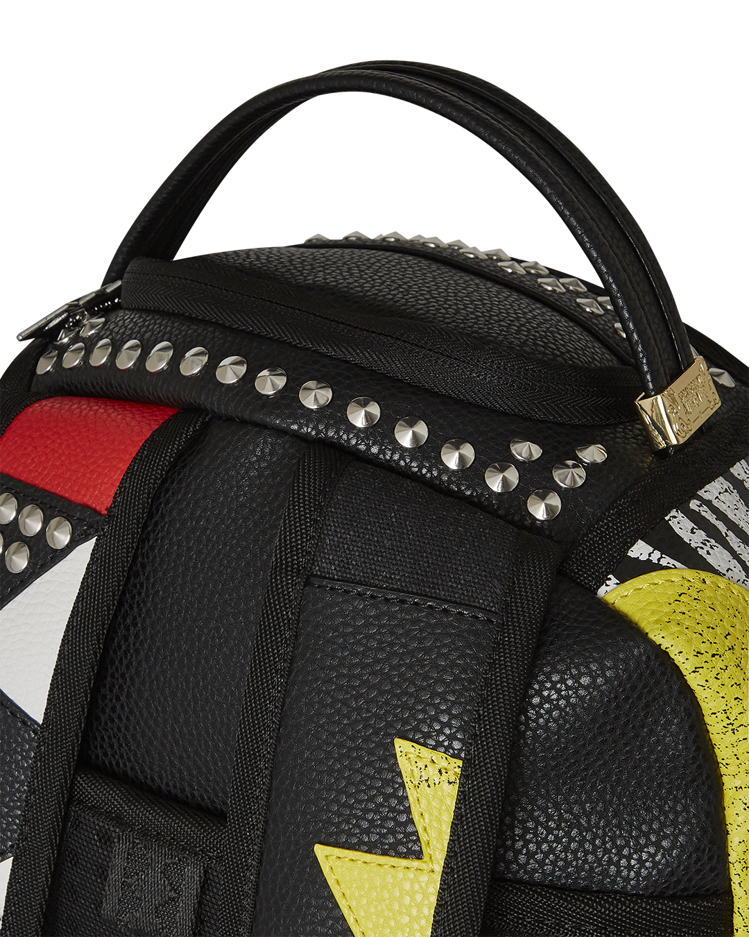 Close-up of the backpacks gold zippers and velour laptop compartment for premium storage.