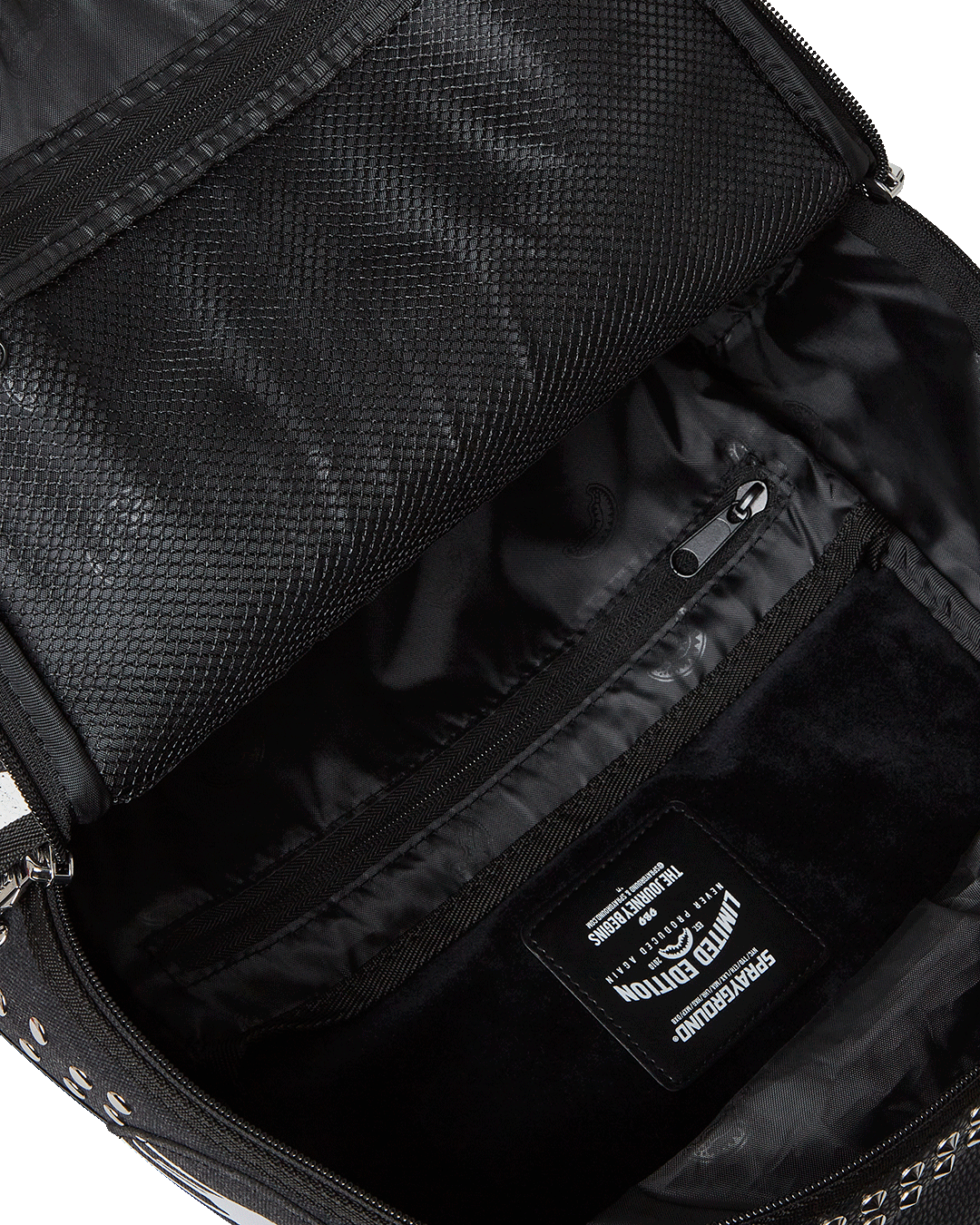 Backpack worn by a model in a city setting, highlighting its adjustable straps and sleek profile.