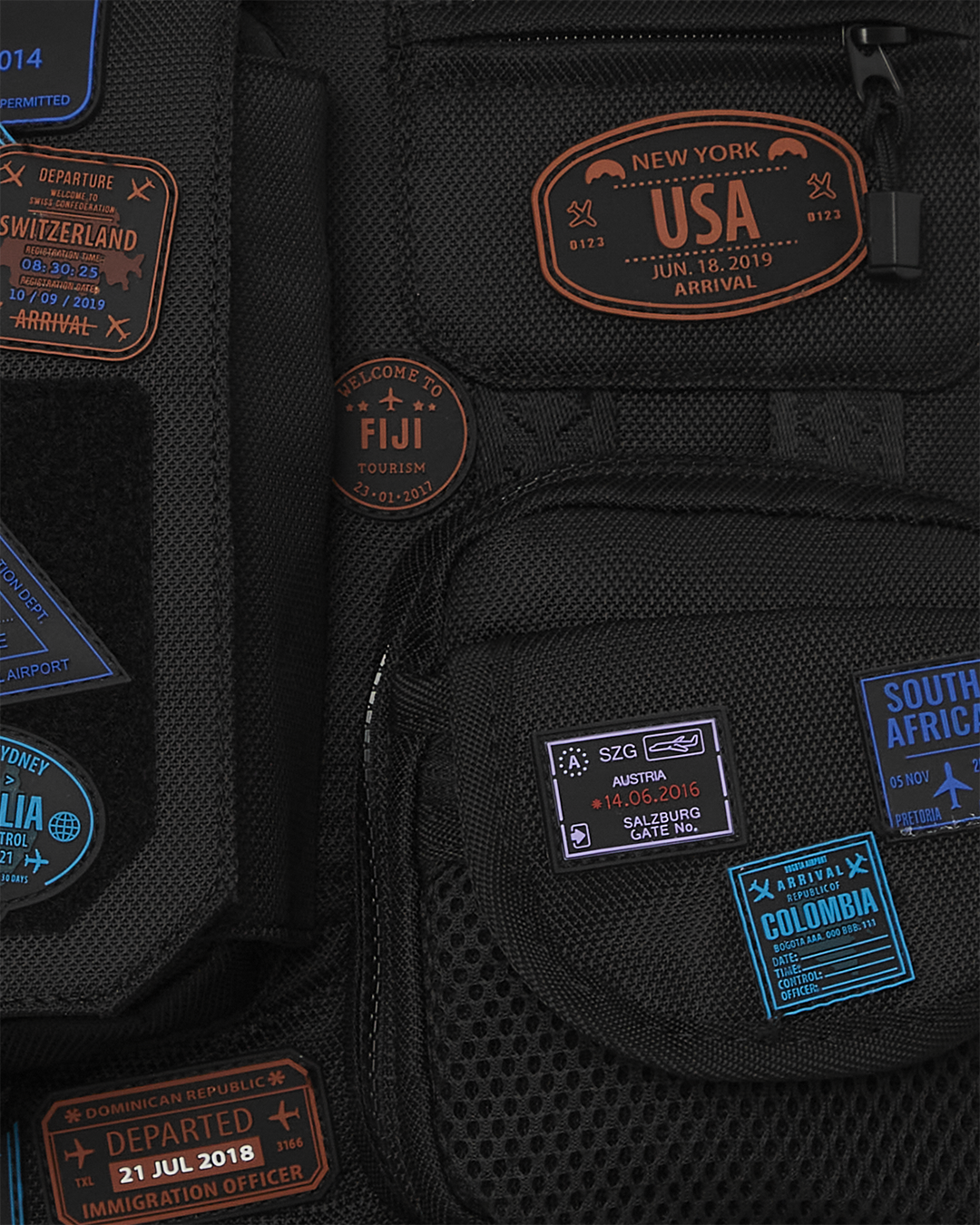 Close-up of faux leather exterior with gold zippers on the backpack