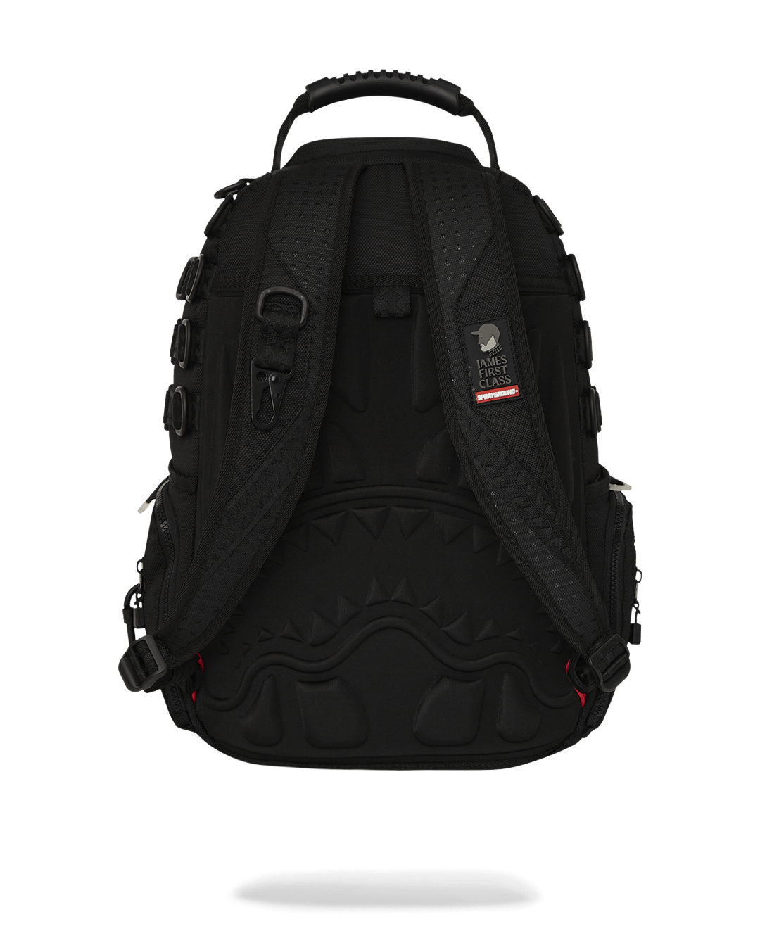 Close-up of faux leather exterior with gold zippers on the backpack